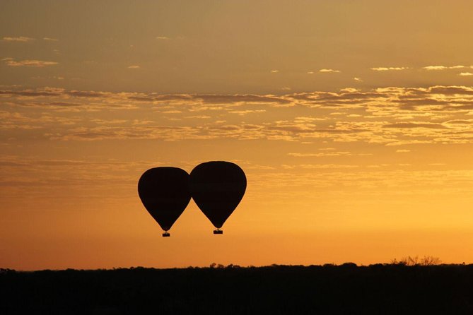 Early Morning Ballooning in Alice Springs - Sunrise over red earth and the MacDonnell Ranges