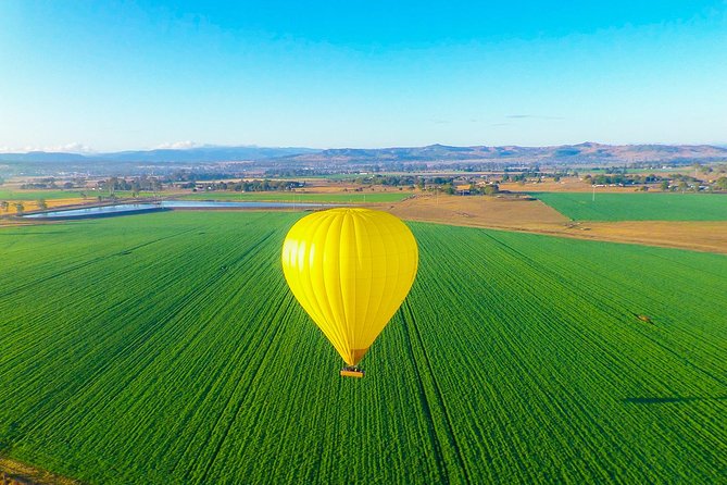 Gold Coast Hot Air Balloon + Winery Breakfast + Return Transfers - Climbing into the basket and lifting off