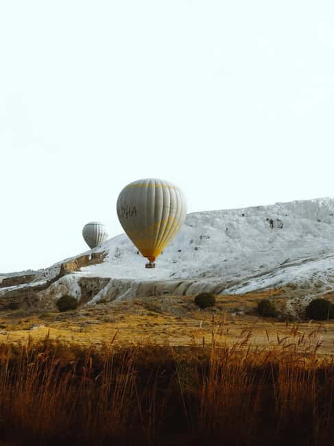 Pamukkale/Cappadocia: Hot Air Balloon Flight /Hotel Transfer - A sunrise above Pamukkale’s white terraces