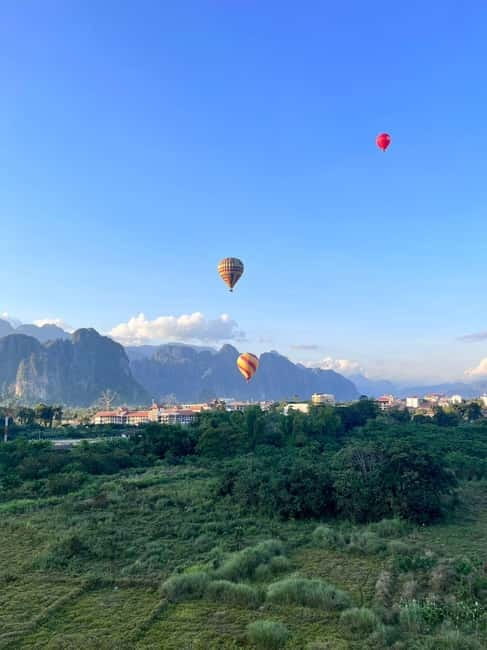 Vang Vieng: Hot Air Balloon Ride with City Hotel Pickup - Seeing Vang Vieng from the balloon basket